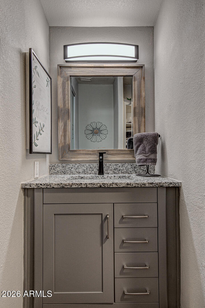 904 North McLane Road Payson, AZ 85541 - Photo 25 of 59 a bathroom with a granite countertop sink and a mirror