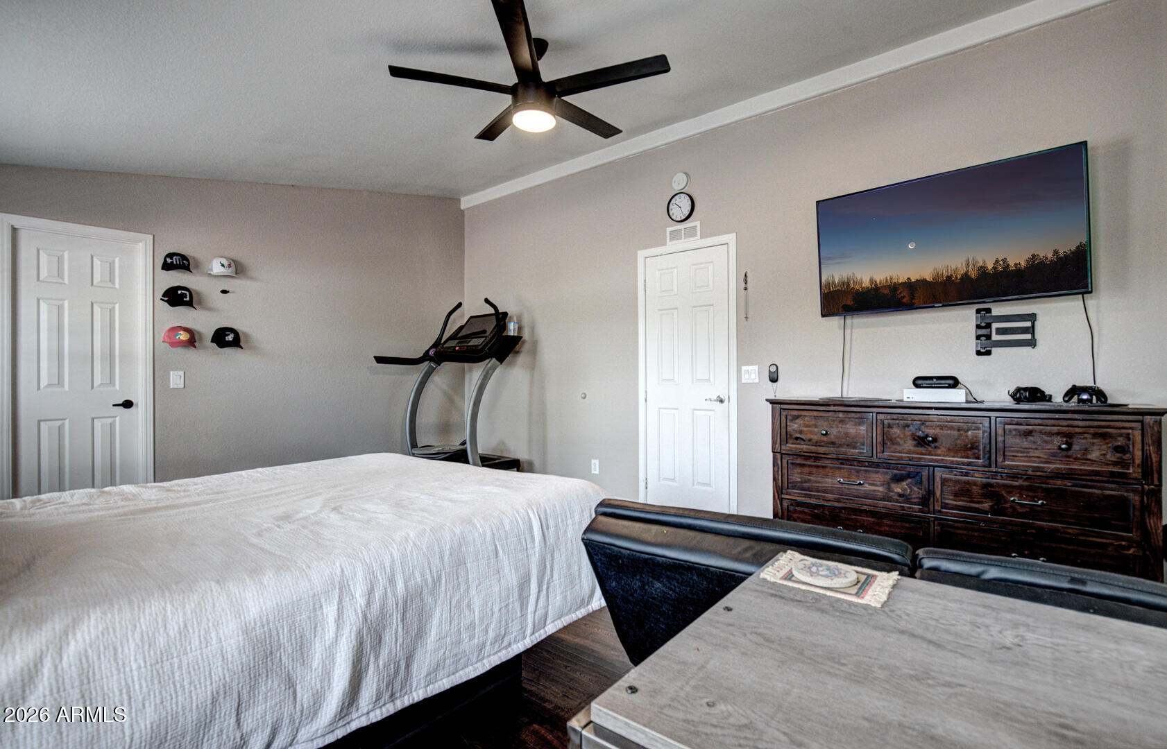 904 North McLane Road Payson, AZ 85541 - Photo 32 of 59 a bedroom with a bed and a flat screen tv