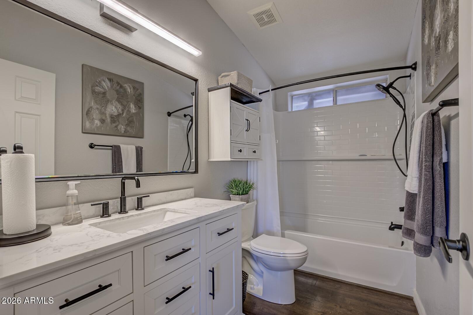 904 North McLane Road Payson, AZ 85541 - Photo 33 of 59 a bathroom with a granite countertop sink toilet and shower