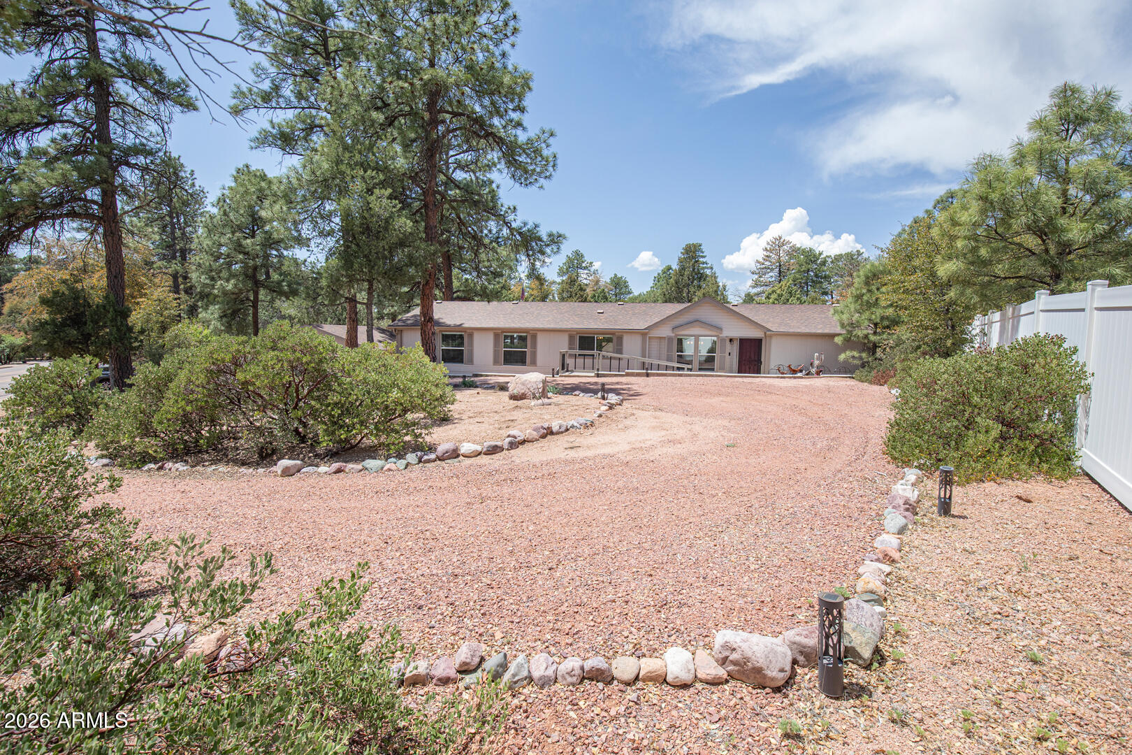 904 North McLane Road Payson, AZ 85541 - Photo 5 of 59 a view of swimming pool with outdoor seating and trees in the background