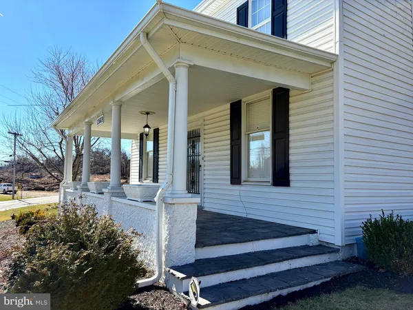 a view of house with outdoor space and porch