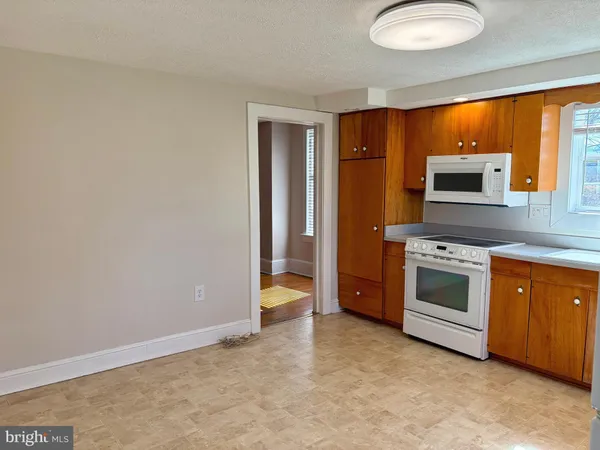a kitchen with stainless steel appliances a stove and a refrigerator