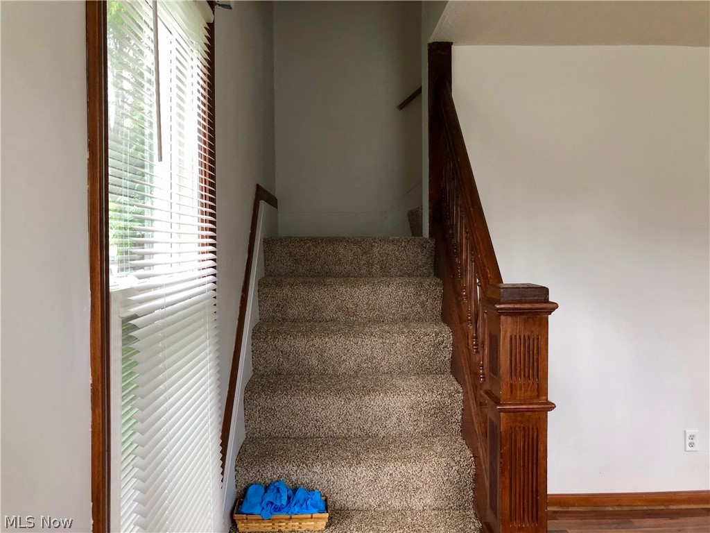 409 Mill Road Ravenna, OH 44266 - Photo 9 of 14 Stairwell with new carpet to 2nd floor