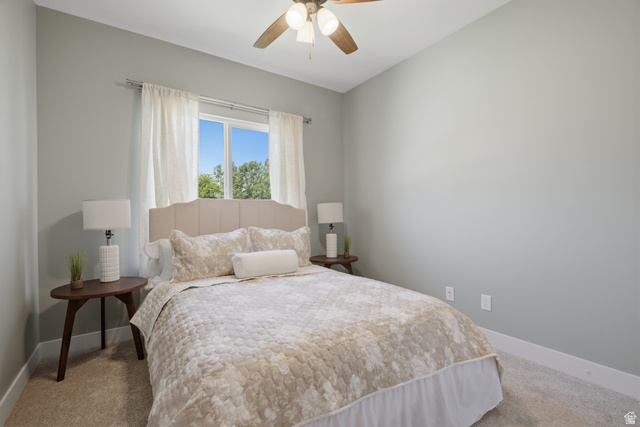 1252 Skyline Road Saratoga Springs, UT 84045 - Photo 22 of 51 Carpeted room featuring a window with white curtains, light-toned walls, and a ceiling fan with integrated lighting