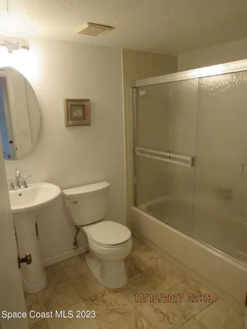 a view of a porch with a floor to ceiling window