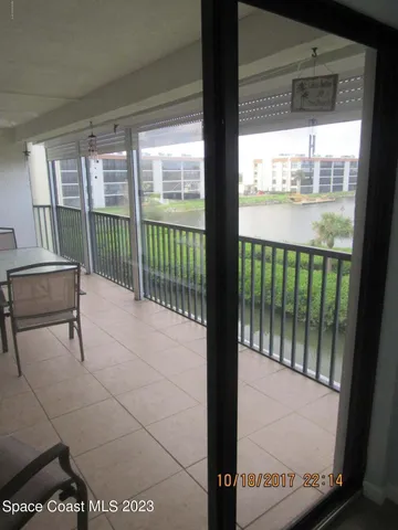 a view of a chairs and table in patio