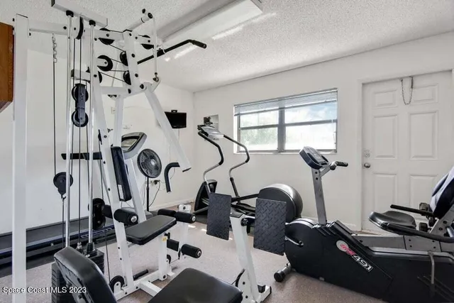 an outdoor space with swimming pool and furniture