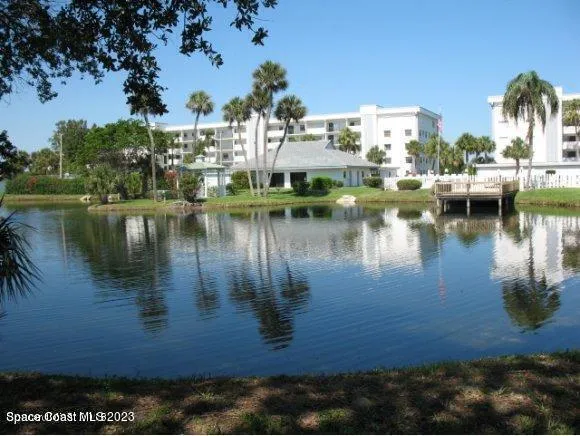 a view of a lake with houses in the back