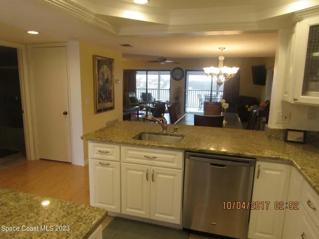 a view of a bathroom with a sink and a mirror