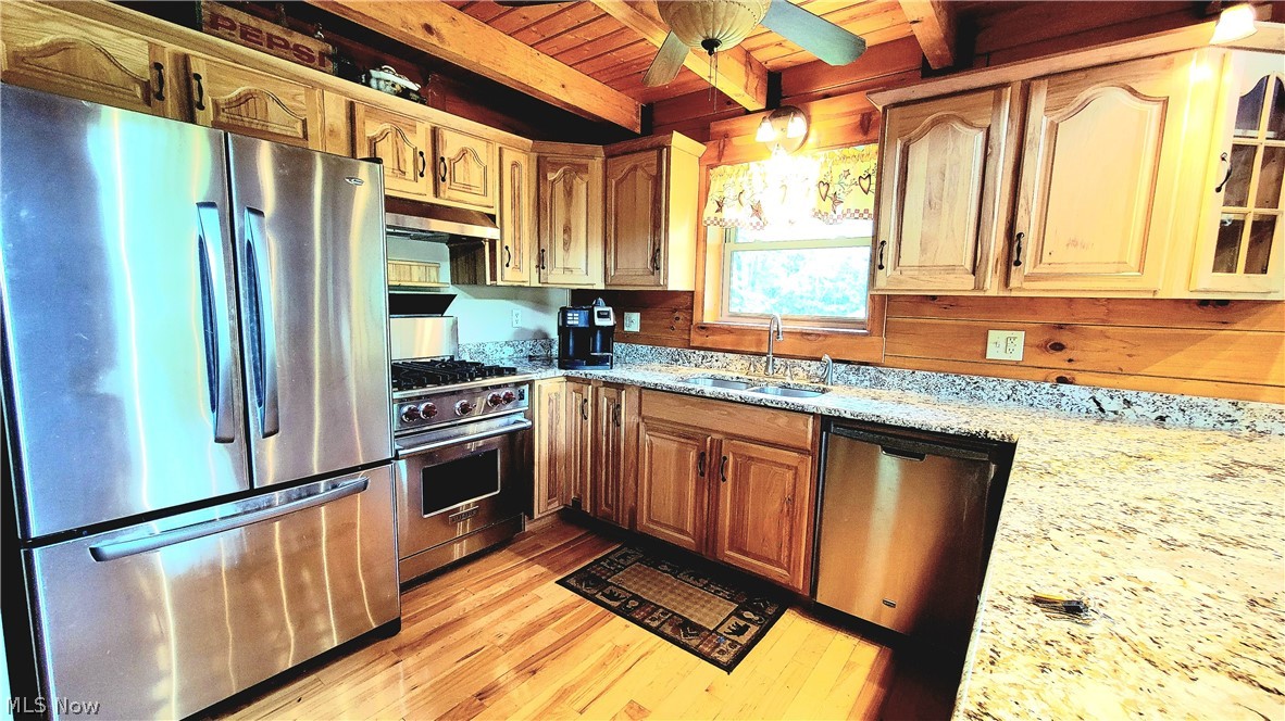 4325 Pleasant Ridge Road Marietta, OH 45750 - Photo 4 of 35 Kitchen featuring ceiling fan, beamed ceiling, wood ceiling, sink, and appliances with stainless steel finishes