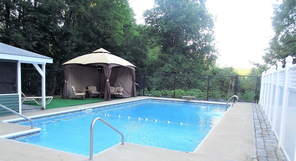 186 Brookfield Road Charlton, MA 01507 - Photo 11 of 28 a view of a patio with swimming pool table and chairs