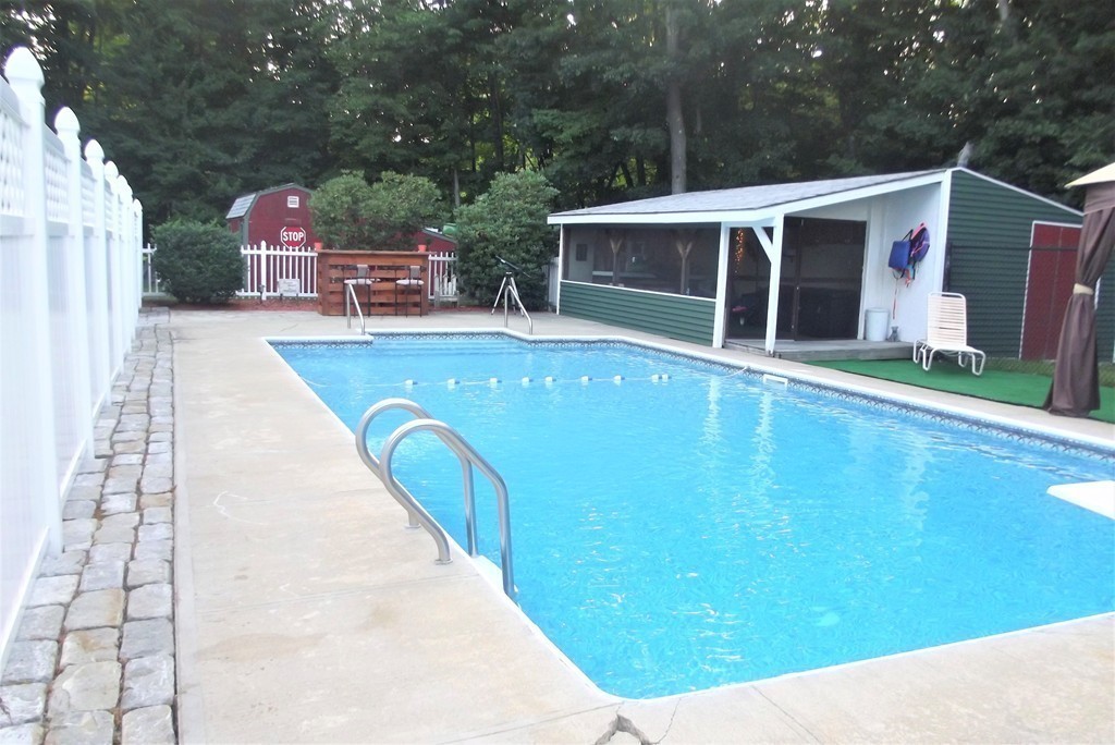 186 Brookfield Road Charlton, MA 01507 - Photo 12 of 28 a view of a house with a backyard