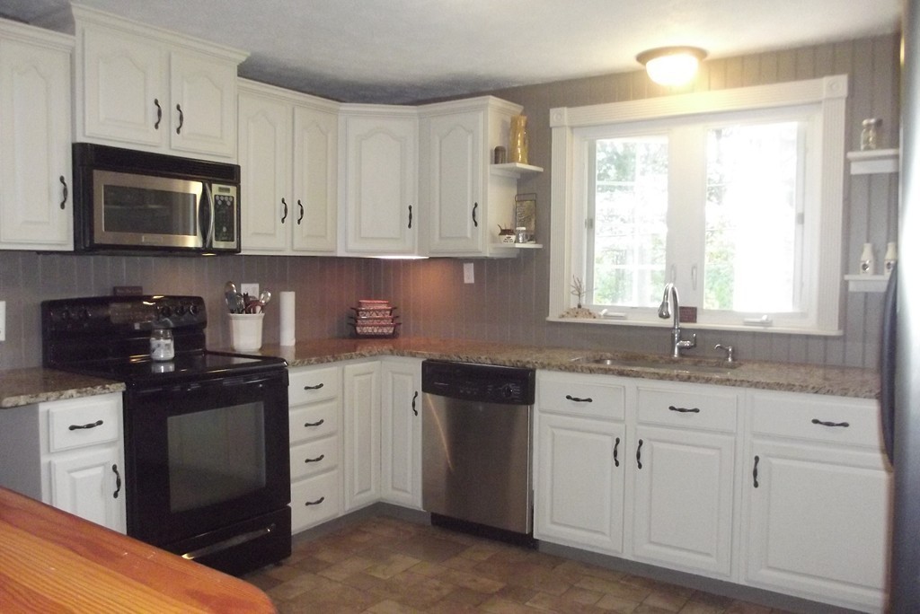186 Brookfield Road Charlton, MA 01507 - Photo 16 of 28 a kitchen with white cabinets appliances and a window