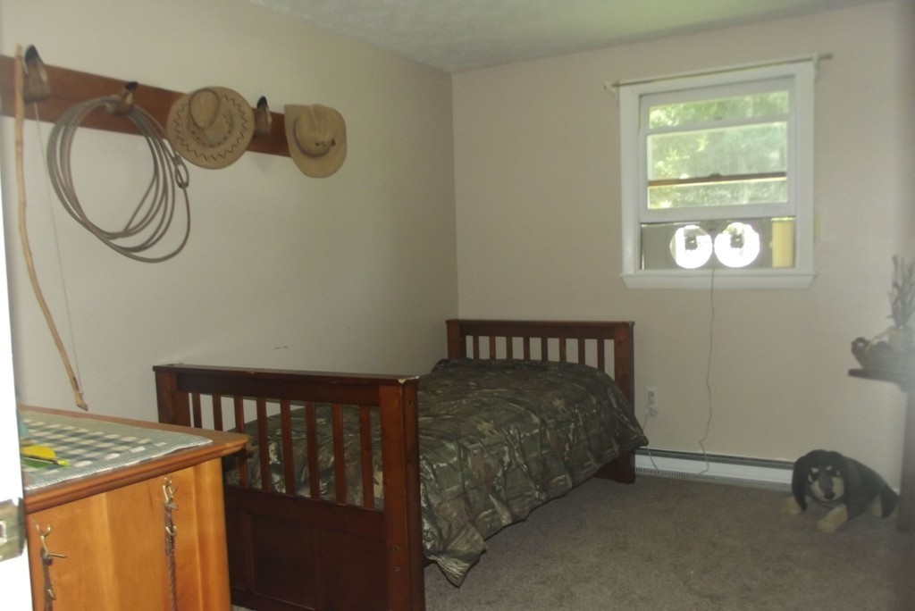 186 Brookfield Road Charlton, MA 01507 - Photo 23 of 28 a bedroom with a bed and a window