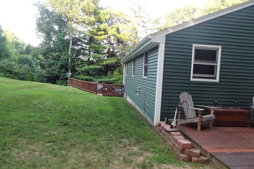 186 Brookfield Road Charlton, MA 01507 - Photo 6 of 28 a garden view with a seating space