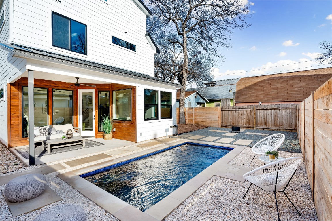 a building outdoor space with patio furniture and potted plants