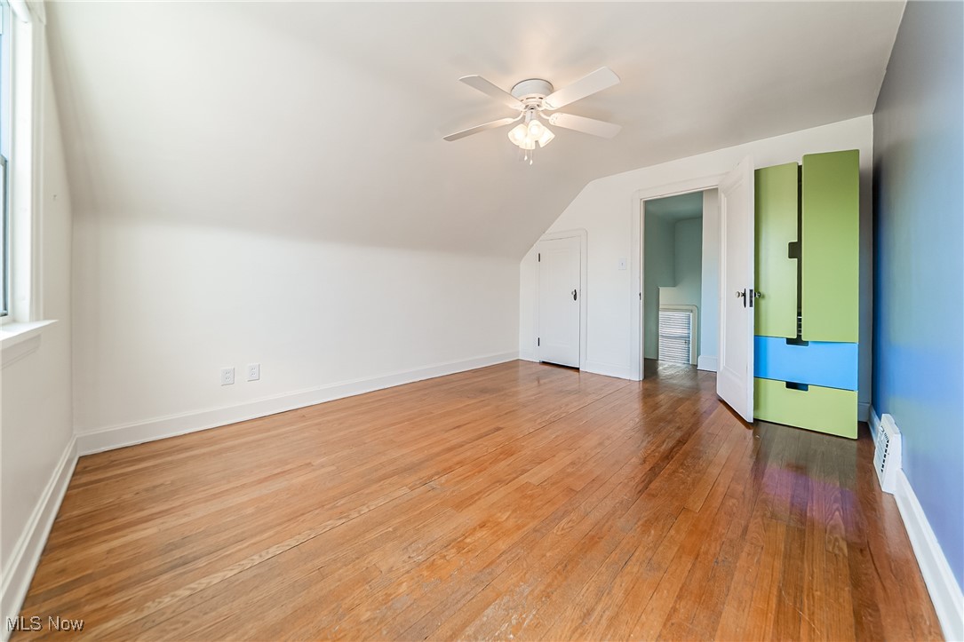 6711 Forest Avenue Parma, OH 44129 - Photo 22 of 33 Bonus room with light wood-type flooring, ceiling fan, vaulted ceiling, and healthy amount of natural light