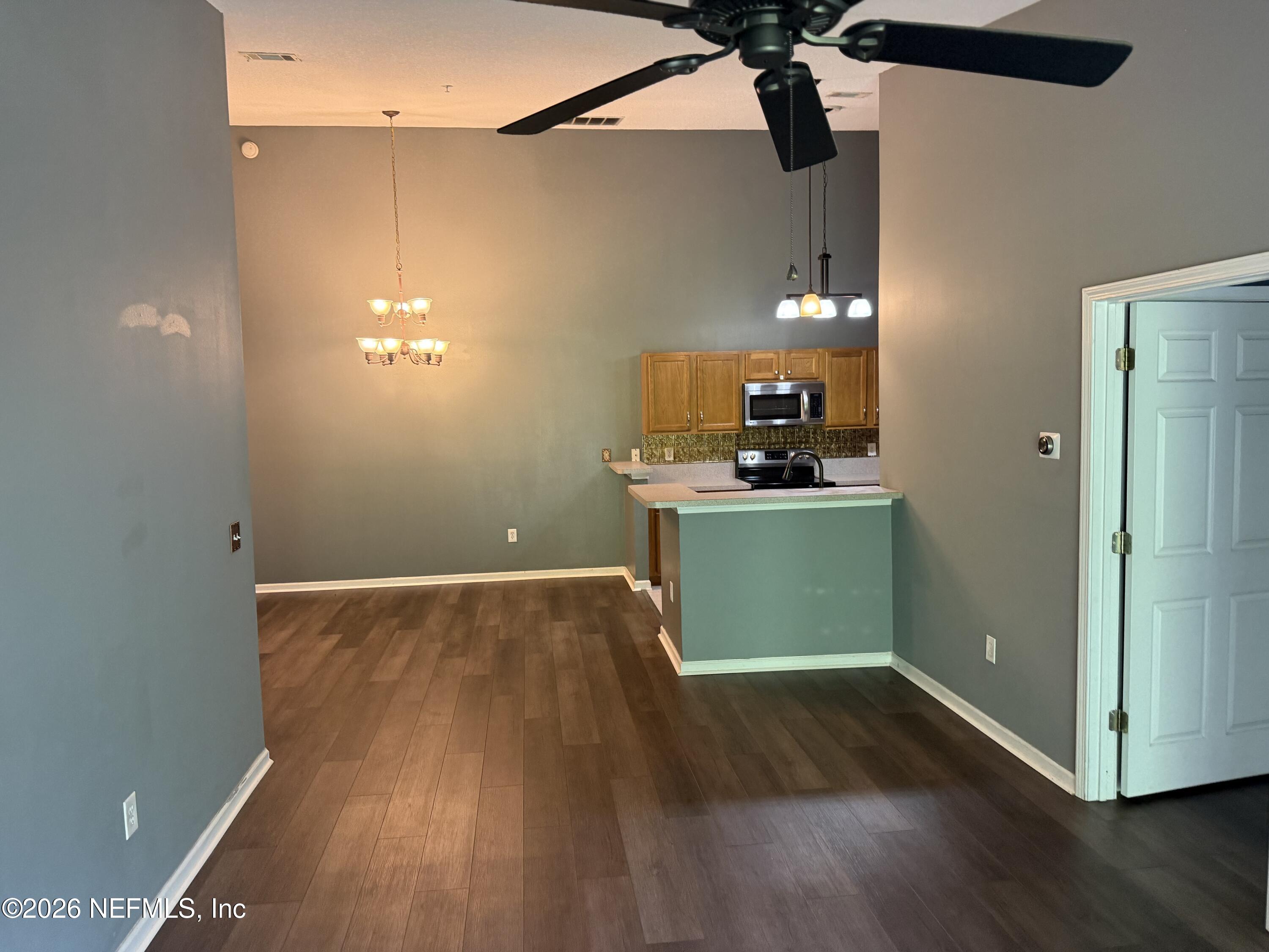 7920 Merrill Road, Unit 914 Jacksonville, FL 32277 - Photo 8 of 19 Living room to kitchen