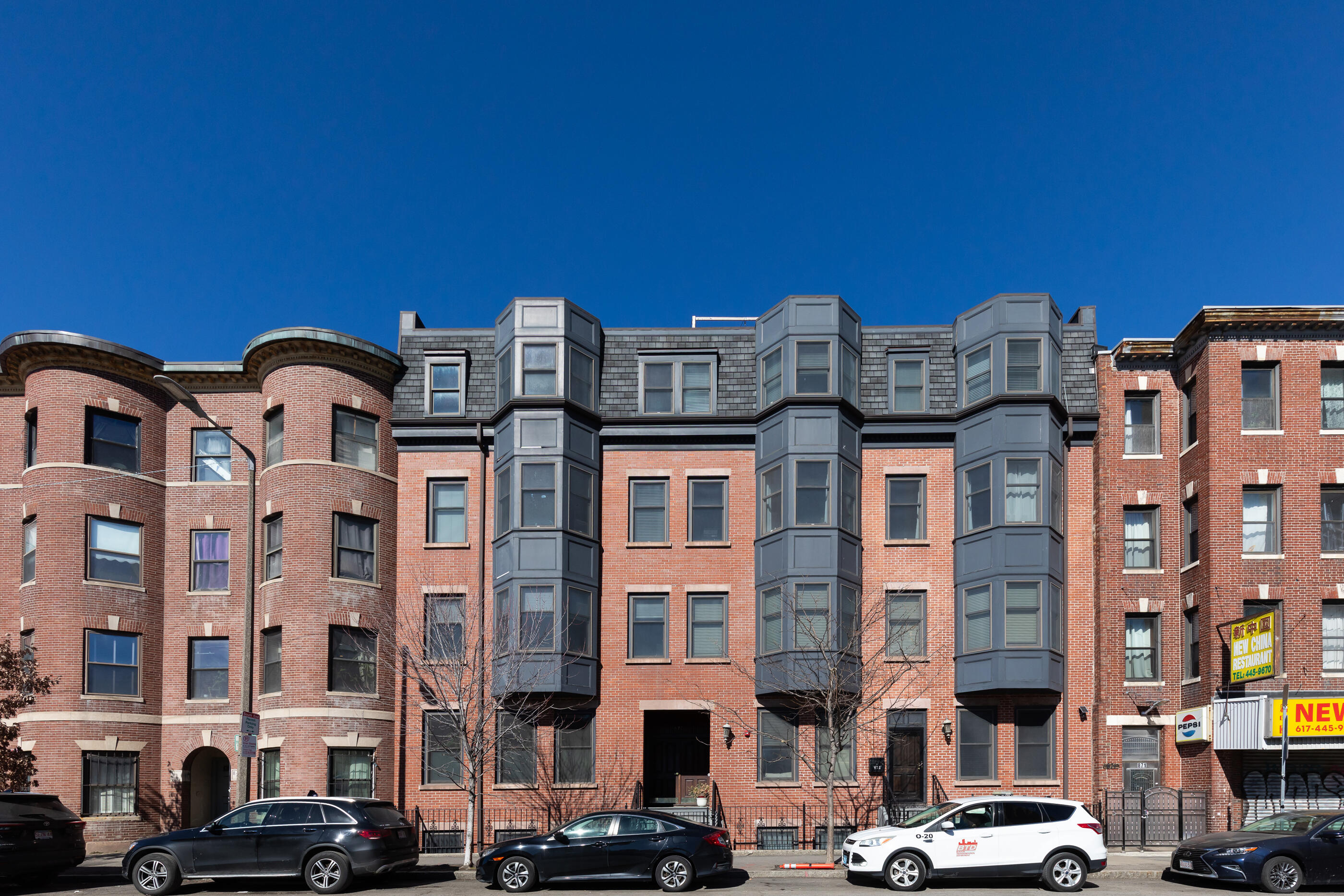 877 Harrison Avenue, Unit 7 Boston, MA 02118 - Photo 2 of 34 a front view of a building with parking space
