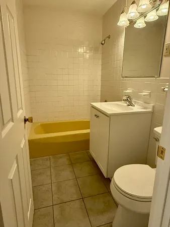 a kitchen with a stove a sink and a refrigerator