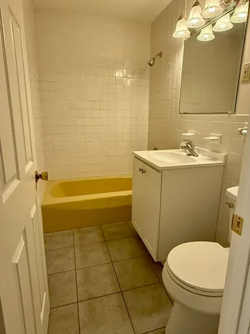 a kitchen with a stove a sink and a refrigerator