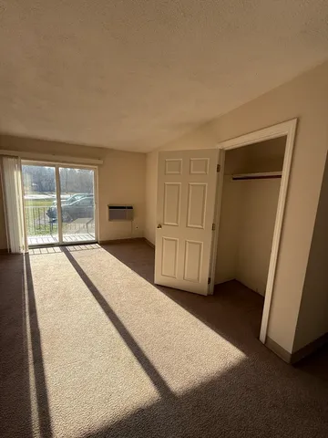 a view of room with window and closet