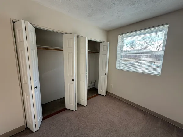 an empty room with a empty space and windows