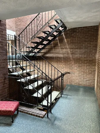 a bedroom with furniture and a potted plant