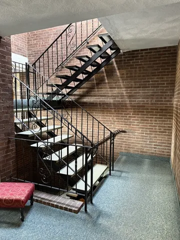 a bedroom with furniture and a potted plant
