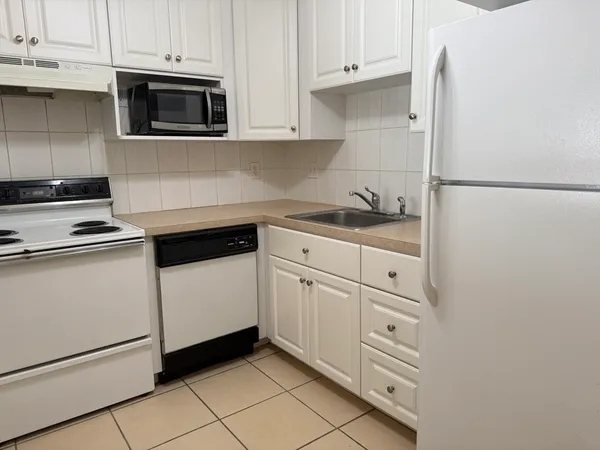 an empty room with windows and yard