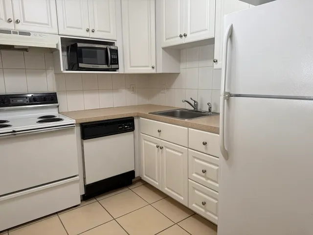 an empty room with windows and yard