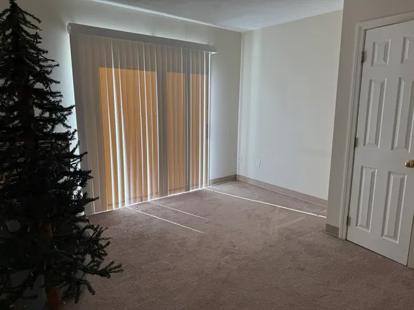 a kitchen with a sink a refrigerator and cabinets