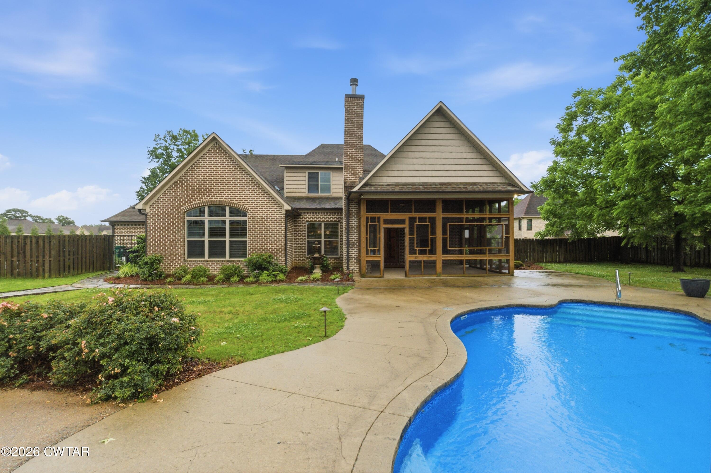 963 Ashport Road Jackson, TN 38305 - Photo 56 of 60 a front view of a house with a yard