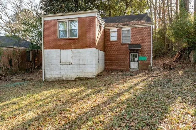 a view of a door of a house with a street