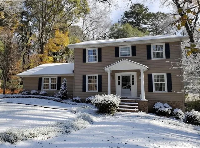 a front view of a house with a yard