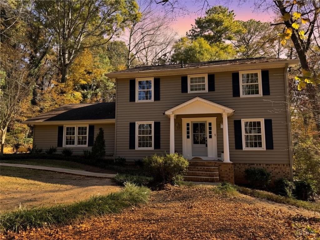 1610 Old Mill Crossing Northeast Marietta, GA 30062 - Photo 1 of 55 a front view of a house with a yard