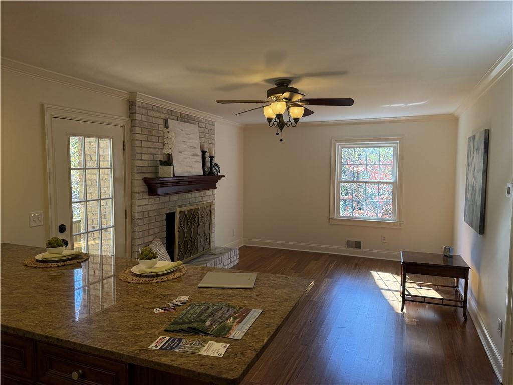 1610 Old Mill Crossing Northeast Marietta, GA 30062 - Photo 17 of 55 a living room with furniture and a fireplace