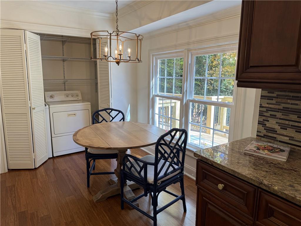 1610 Old Mill Crossing Northeast Marietta, GA 30062 - Photo 22 of 55 a view of a dining room with furniture window and wooden floor