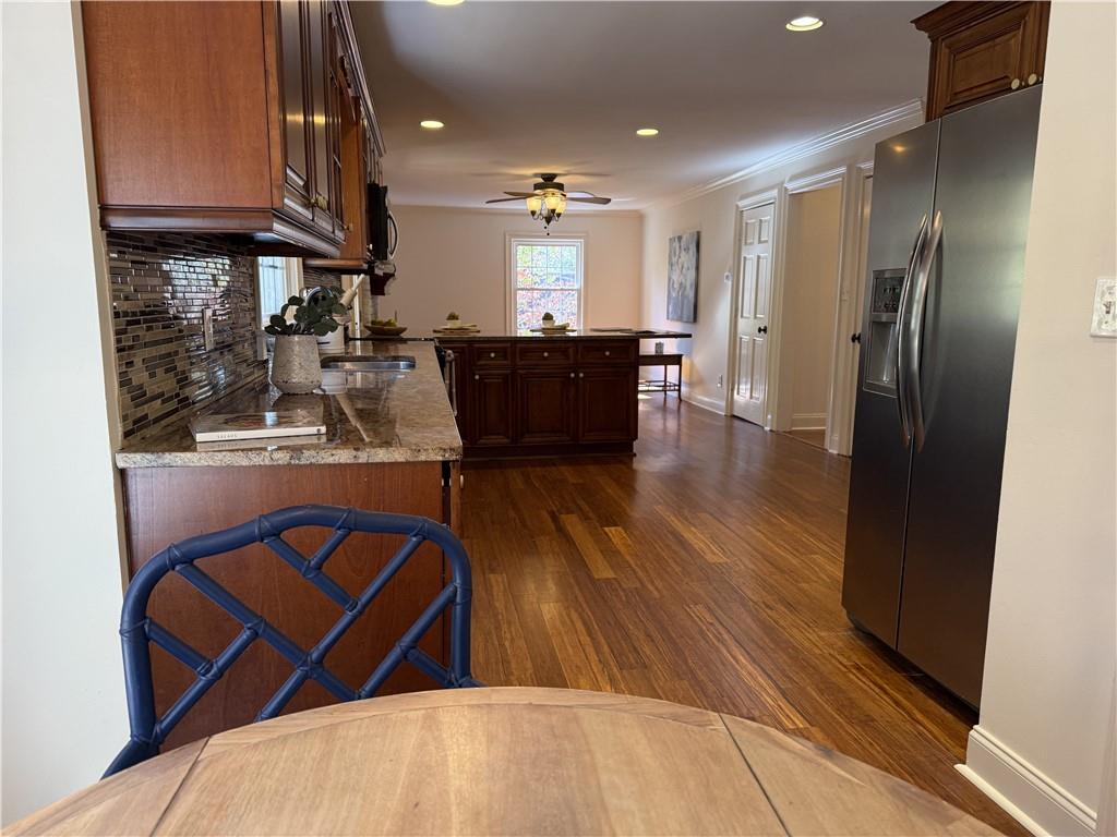 1610 Old Mill Crossing Northeast Marietta, GA 30062 - Photo 23 of 55 a kitchen with stainless steel appliances granite countertop a refrigerator a stove and a wooden floors