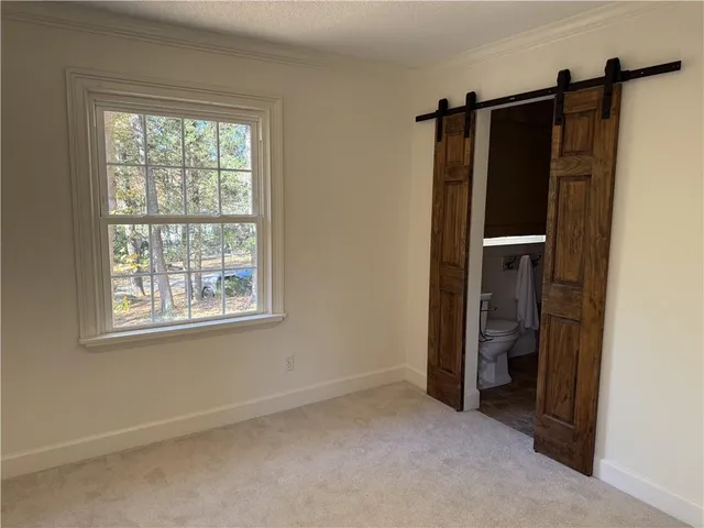 a view of livingroom with furniture and window