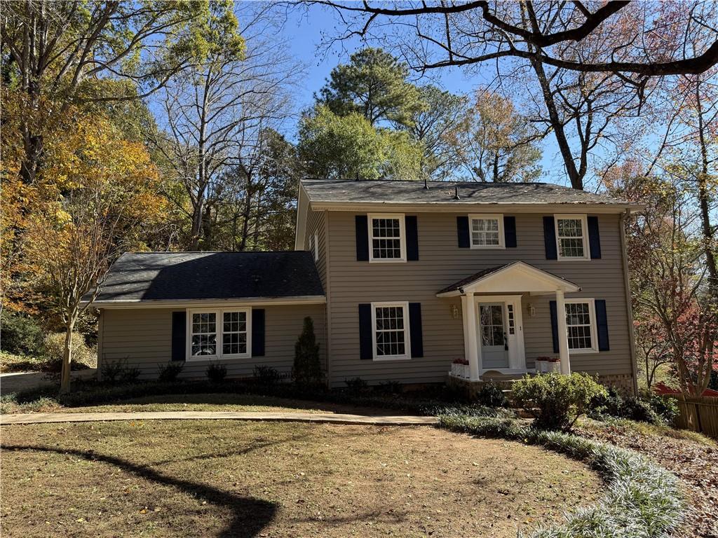 1610 Old Mill Crossing Northeast Marietta, GA 30062 - Photo 3 of 55 a front view of a house with a yard