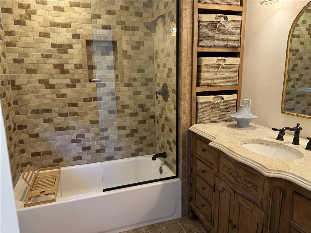 1610 Old Mill Crossing Northeast Marietta, GA 30062 - Photo 32 of 55 a bathroom with a granite countertop sink a toilet and shower