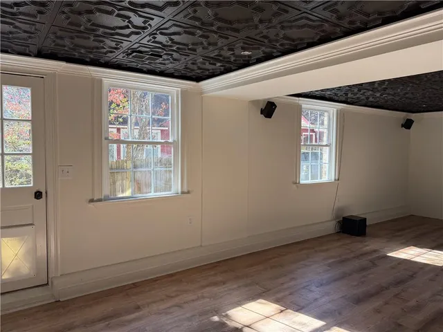 a view of hallway with wooden floor