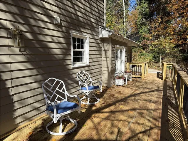 a backyard of a house with outdoor seating