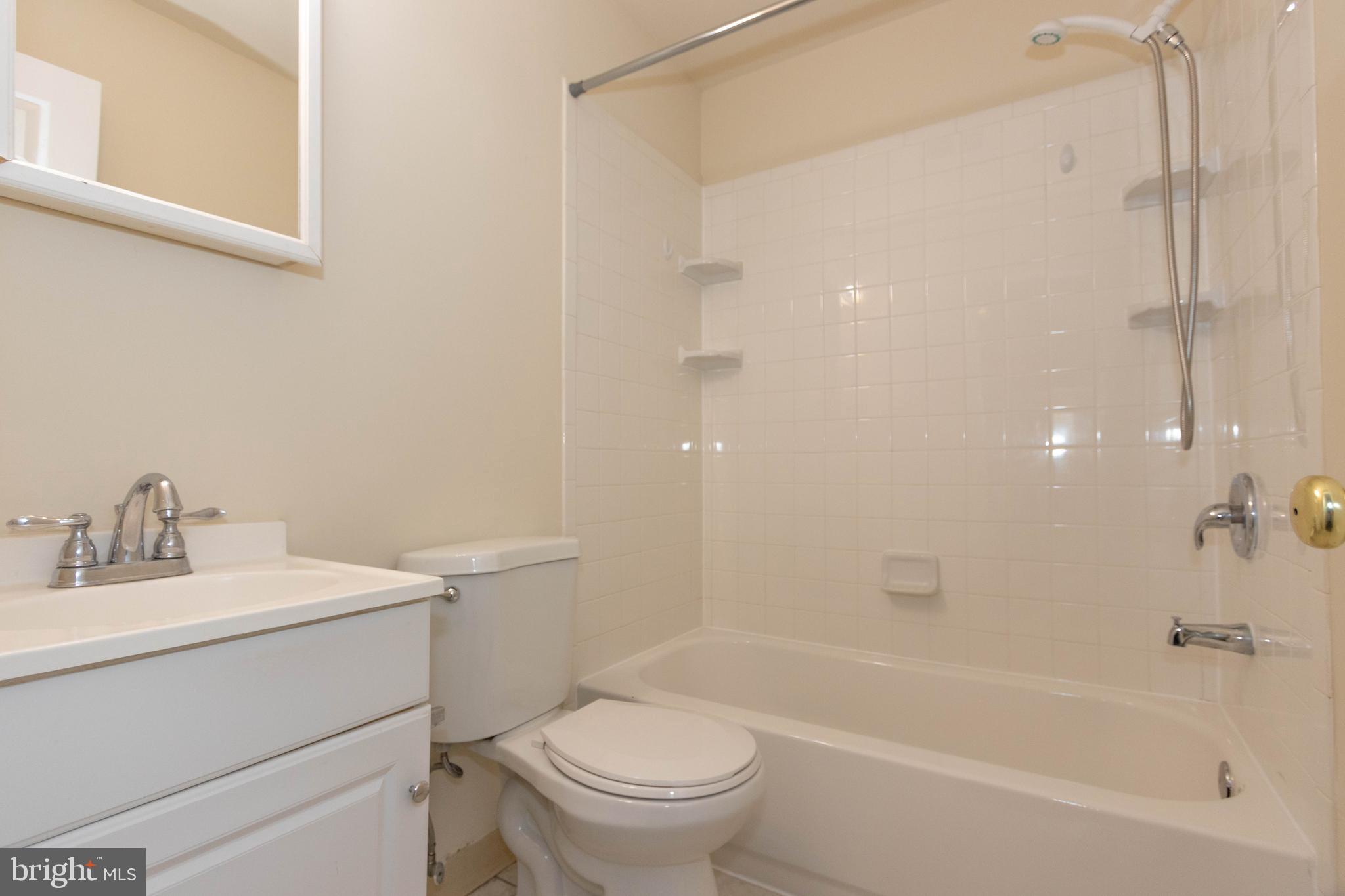 9206 Hood Road Manassas, VA 20110 - Photo 14 of 25 a bathroom with a sink toilet and shower
