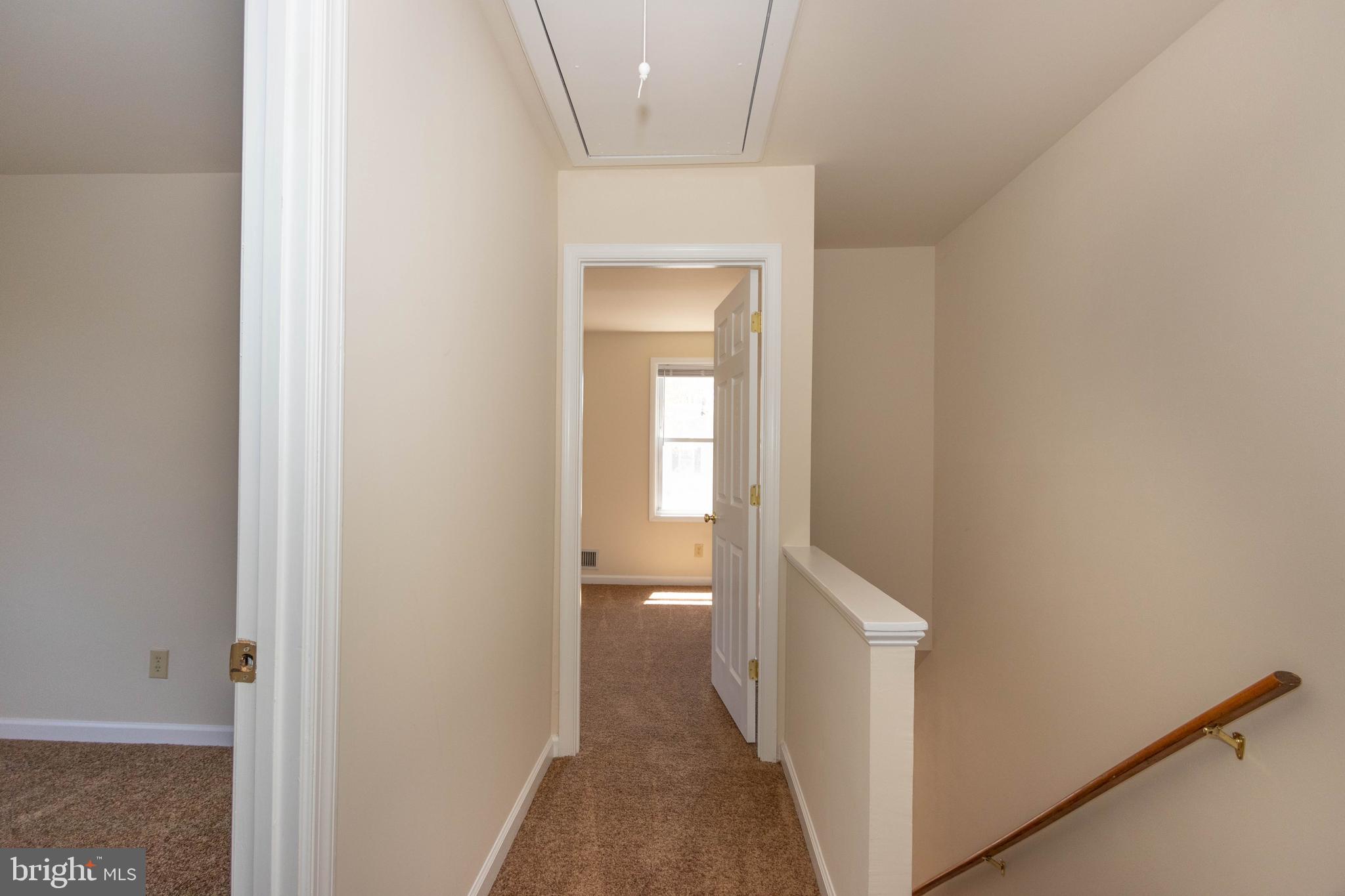 9206 Hood Road Manassas, VA 20110 - Photo 15 of 25 a view of a hallway with a white walls