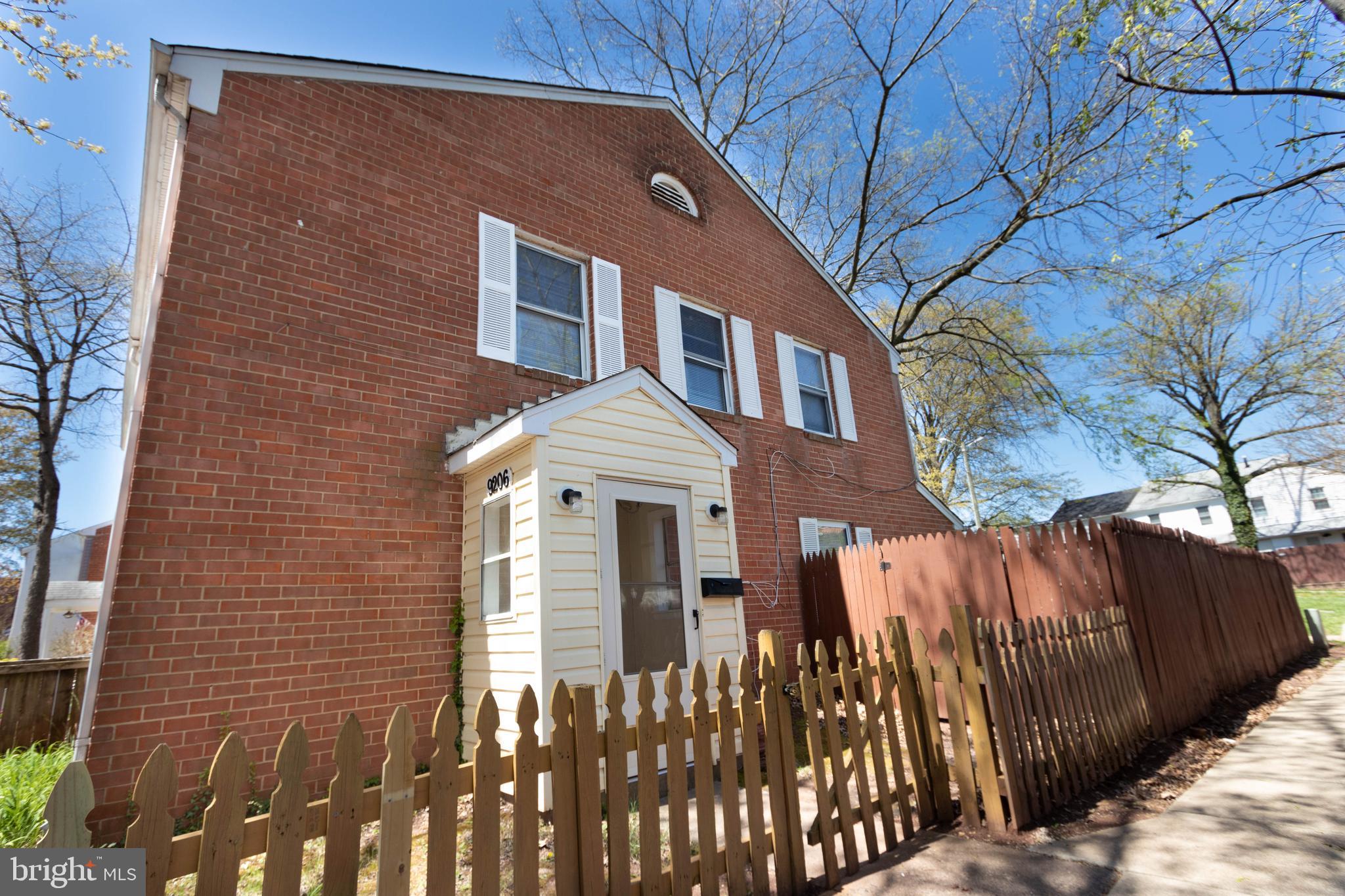 9206 Hood Road Manassas, VA 20110 - Photo 2 of 25 a front view of a house with a garden