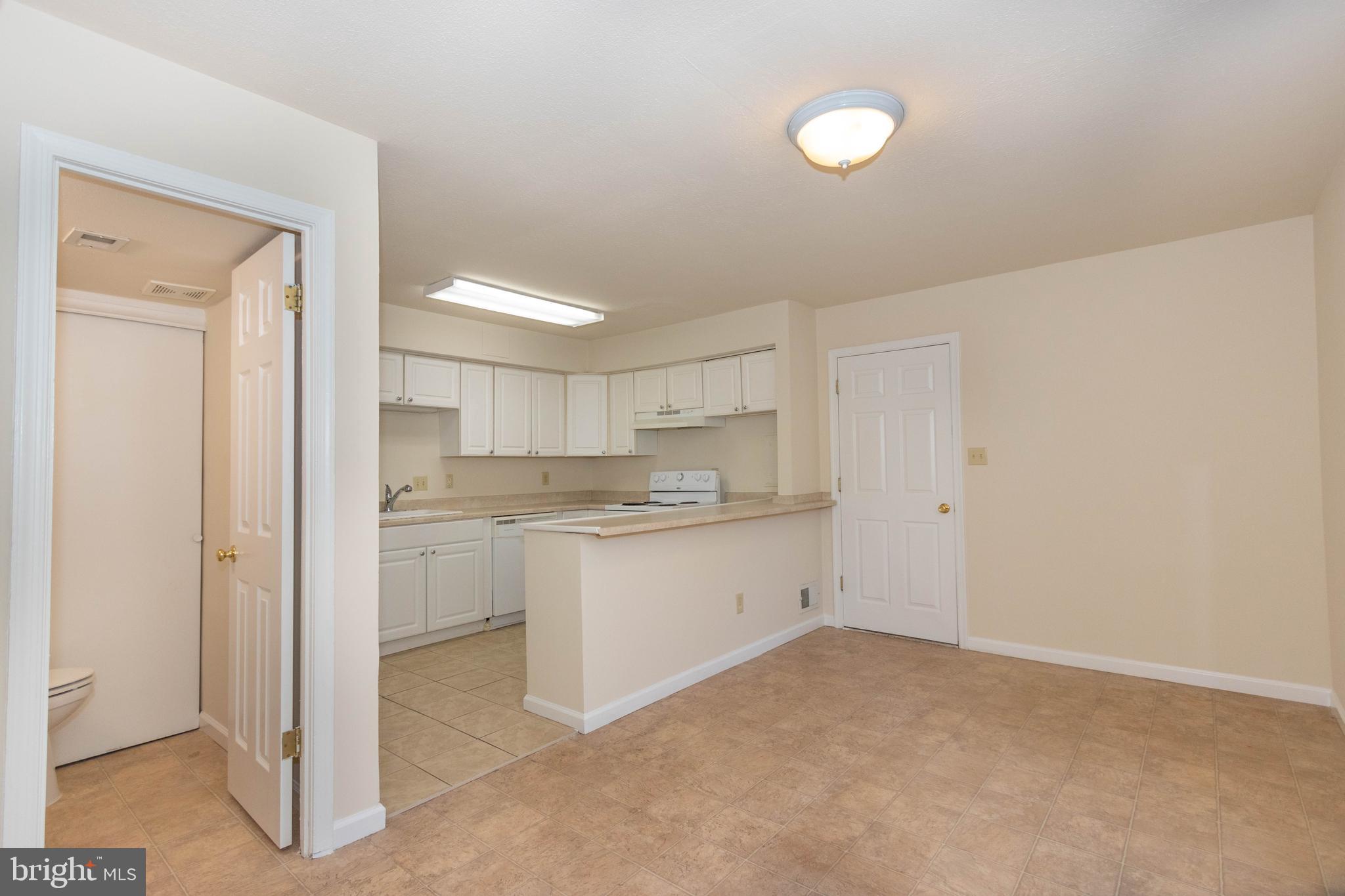 9206 Hood Road Manassas, VA 20110 - Photo 4 of 25 a room with a white wall cabinets and a sink