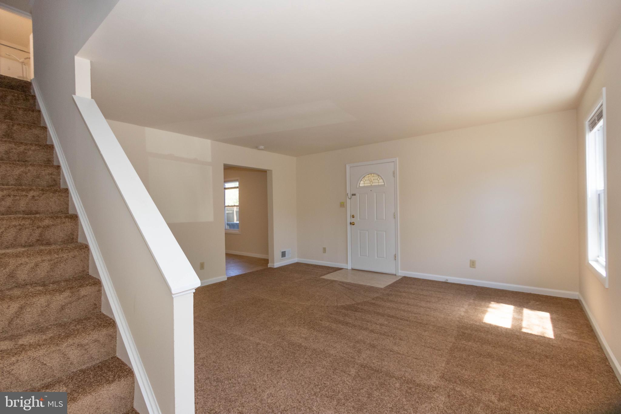 9206 Hood Road Manassas, VA 20110 - Photo 10 of 25 a view of an empty room with stairs