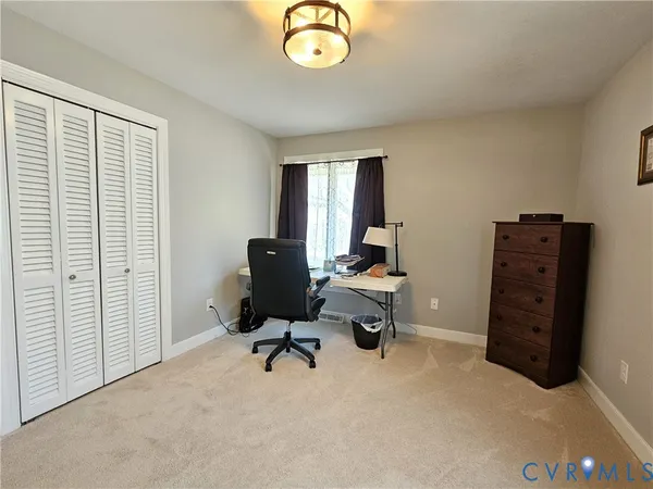 a view of a workspace with furniture